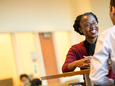 Staff members chatting in the Gaughan Center